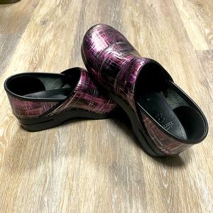 Pair of red, silver, and black Dansko. Size 41, American equivalent size 9.5